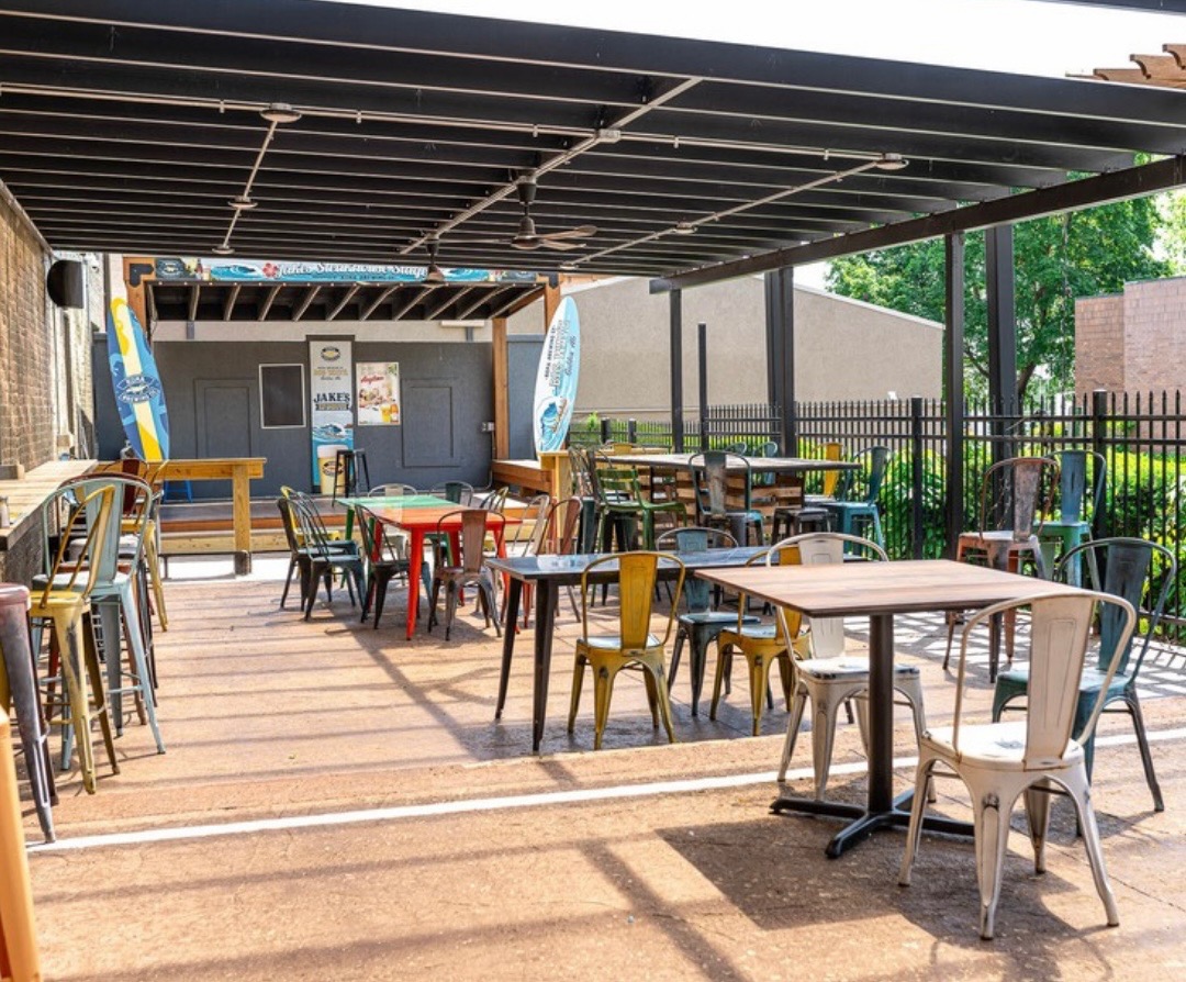 outdoor patio with tables and chairs
