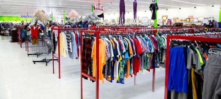 image of an inside of a thrift store with racks of clothing